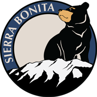 School Logo features a bear standing over the mountain after which the school was named.