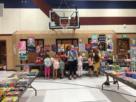 students buying books from the book fair