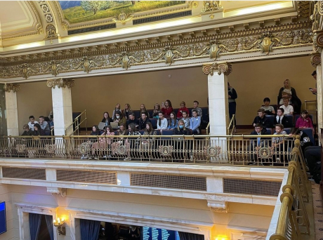 Students sitting in a live session at the capital