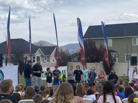 kids singing the school song during the arbor day celebration