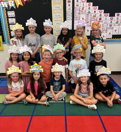 A class wearing their handmade hat for the first day of school