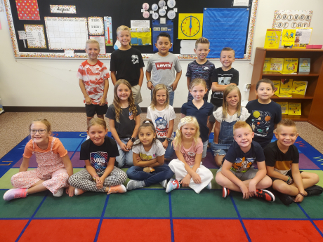 A class smiling on the first day of school 
