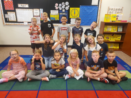 A class smiling on the first day of school 