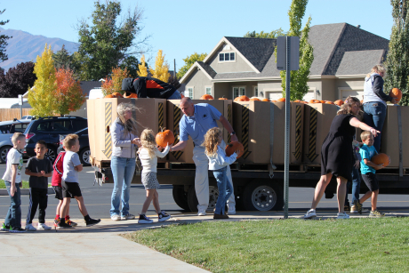 Students getting pumpkins