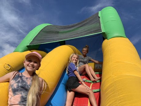 students climbing the bouncy house