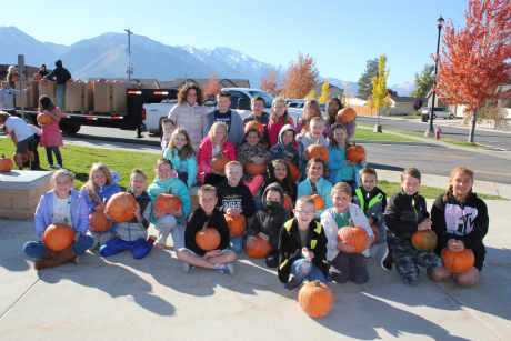 Mrs. Evans Class holding pumpkins