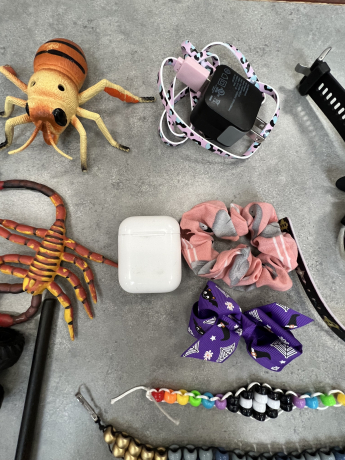 hair ties, apple charger and squishy animals in the lost and found