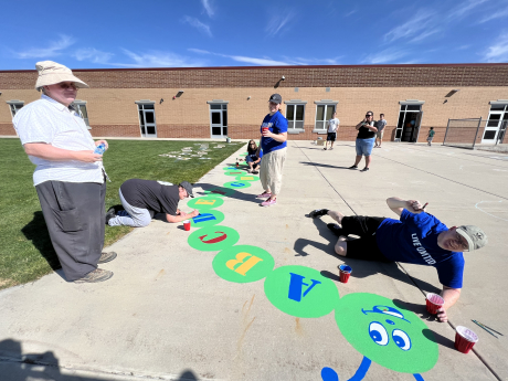 BYU faculty painting the A through Z caterpillar