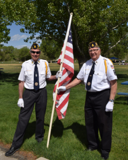 Two Veterans holding the USA flag